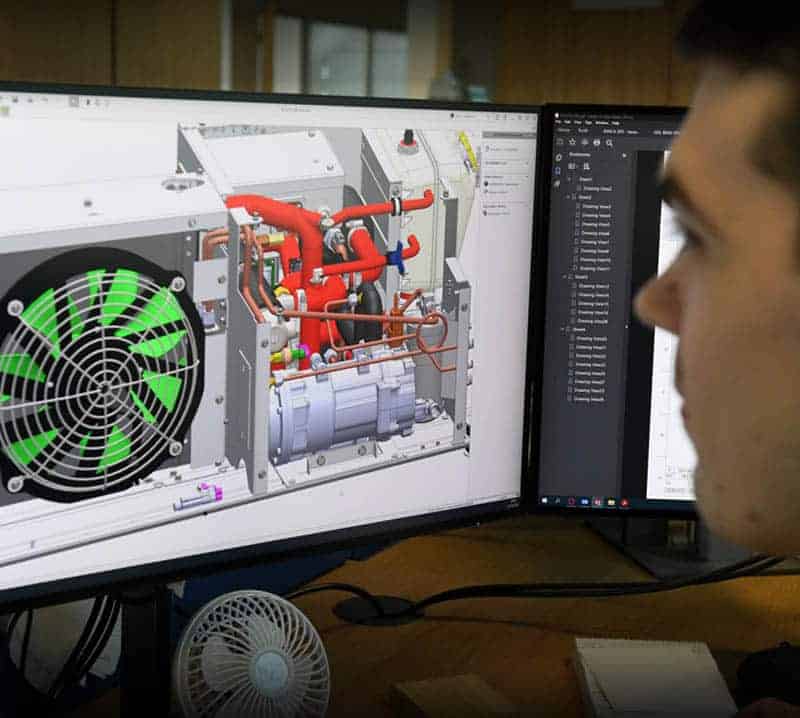 Grayson Thermal Systems' design engineer reviewing 3D CAD model of Battery Thermal Management System